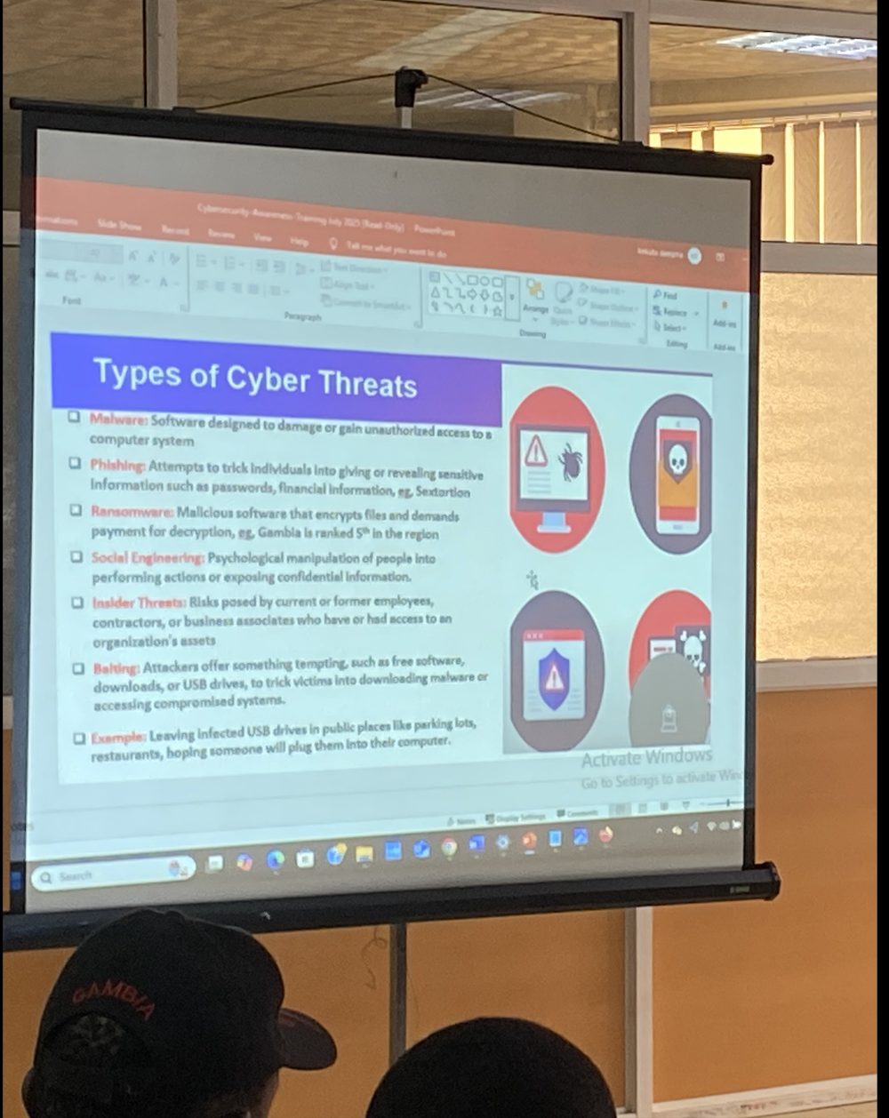 Slide covering the types of cyber threats, presented on-site